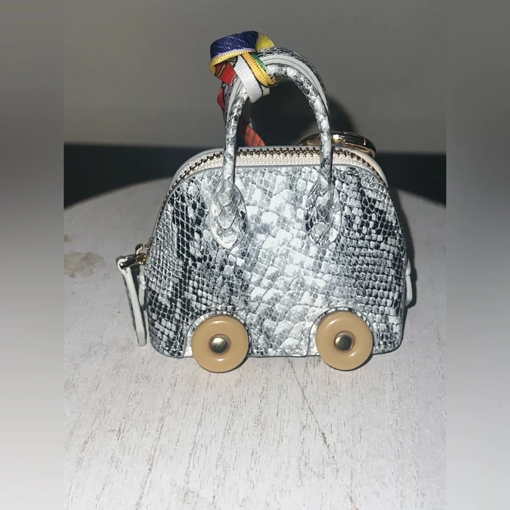 Silver Snake-Print Key &‎ Card Holder with Beige Wheel Accents